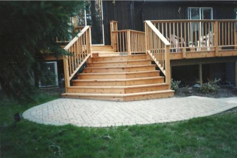 Sweeping wood steps to a wood deck.